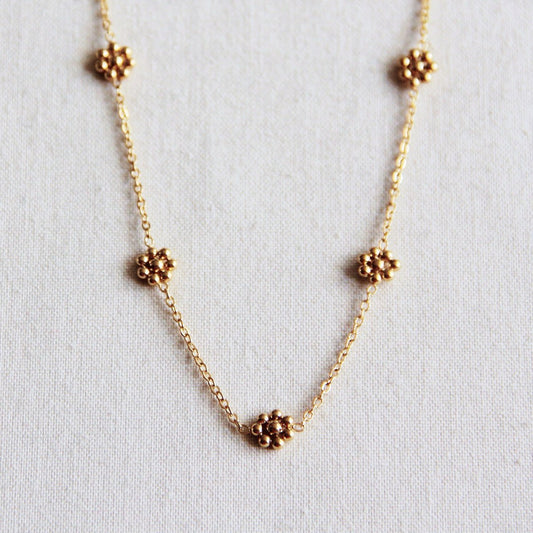 Roestvrij stalen ketting met fijne madeliefjesbloemen - goud